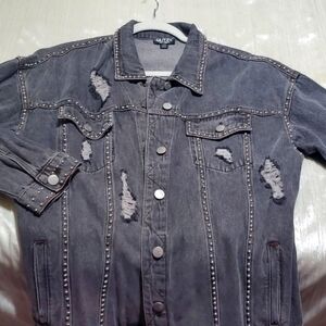 Distressed black jean jacket with studs. NWT